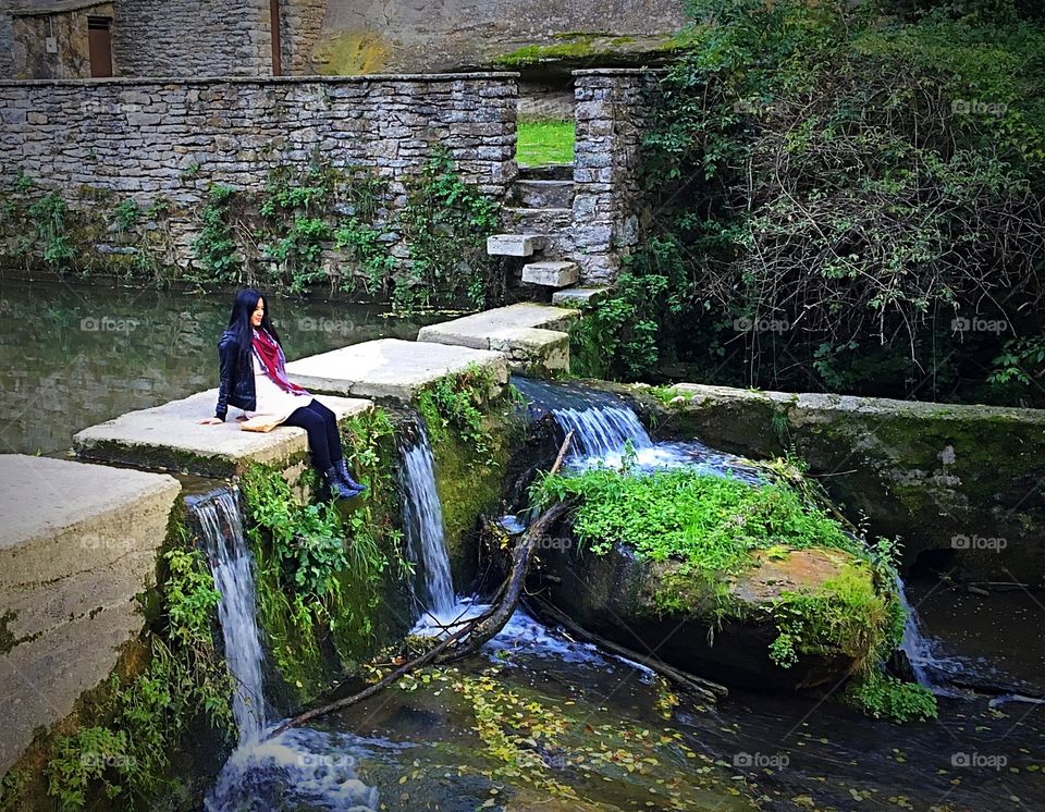 Woman enjoying view of waterfall