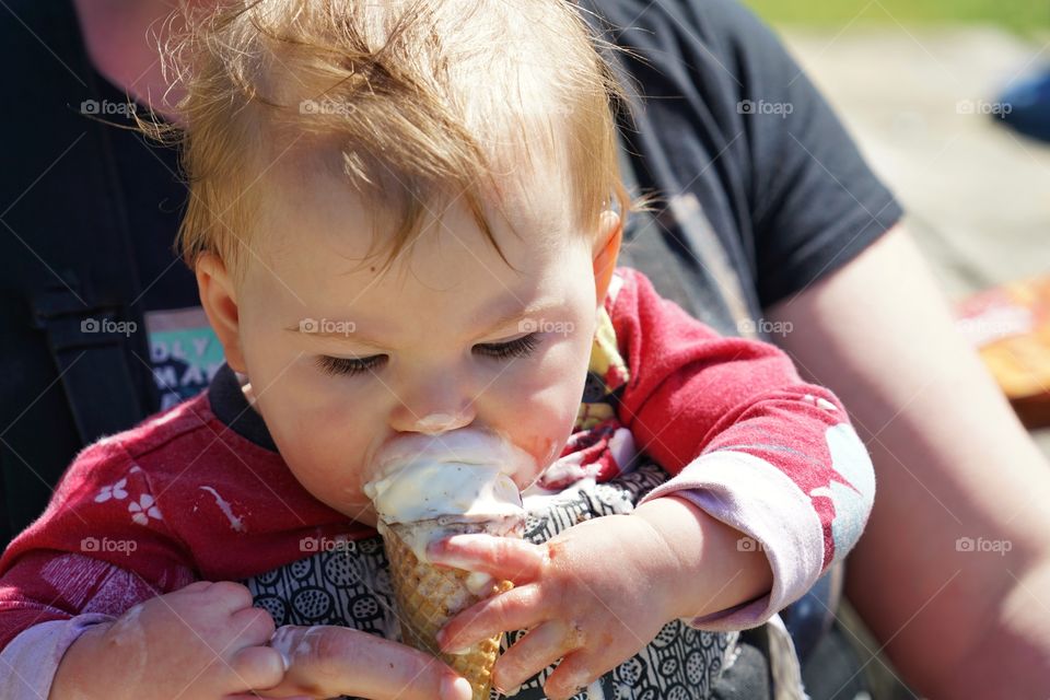 Baby Girl Eating Vanilla Ice Cream