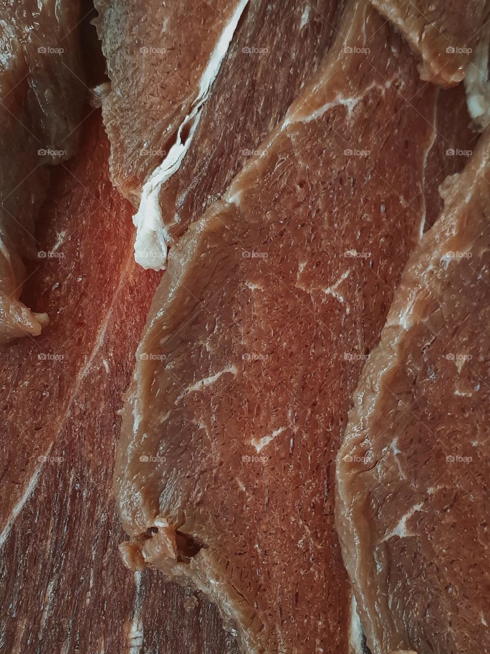 Macro photo of raw beef steaks