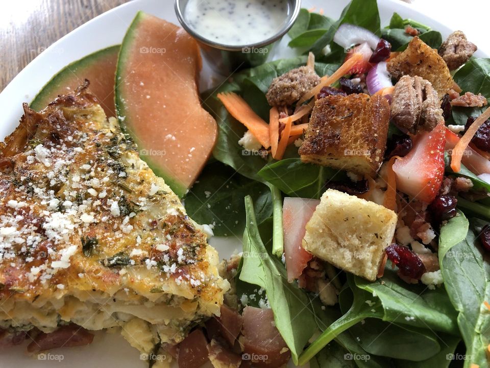 Quiche with cantaloupe and salad 