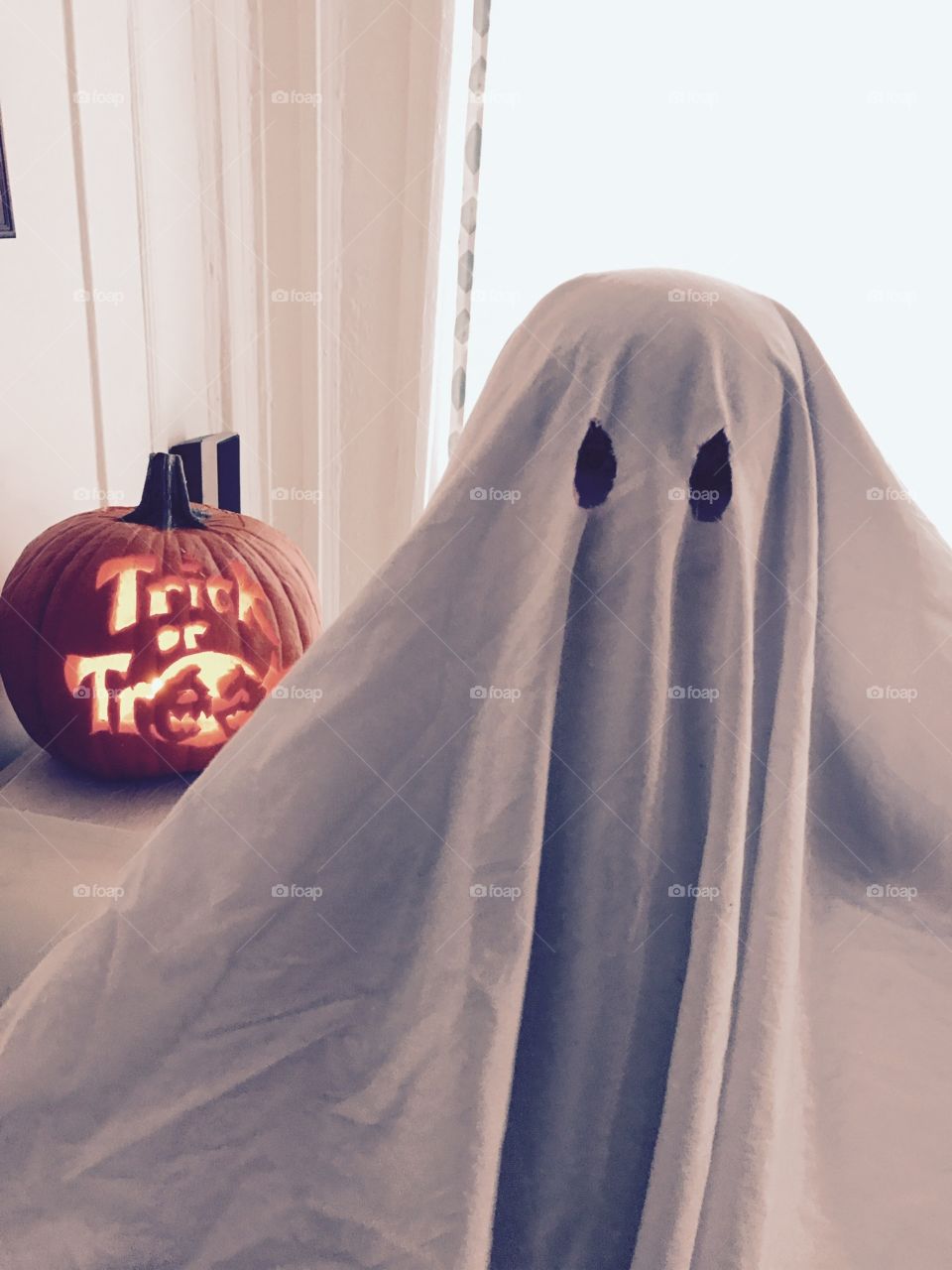 A white sheet ghost always sends a chill, especially one who can carve a pumpkin.