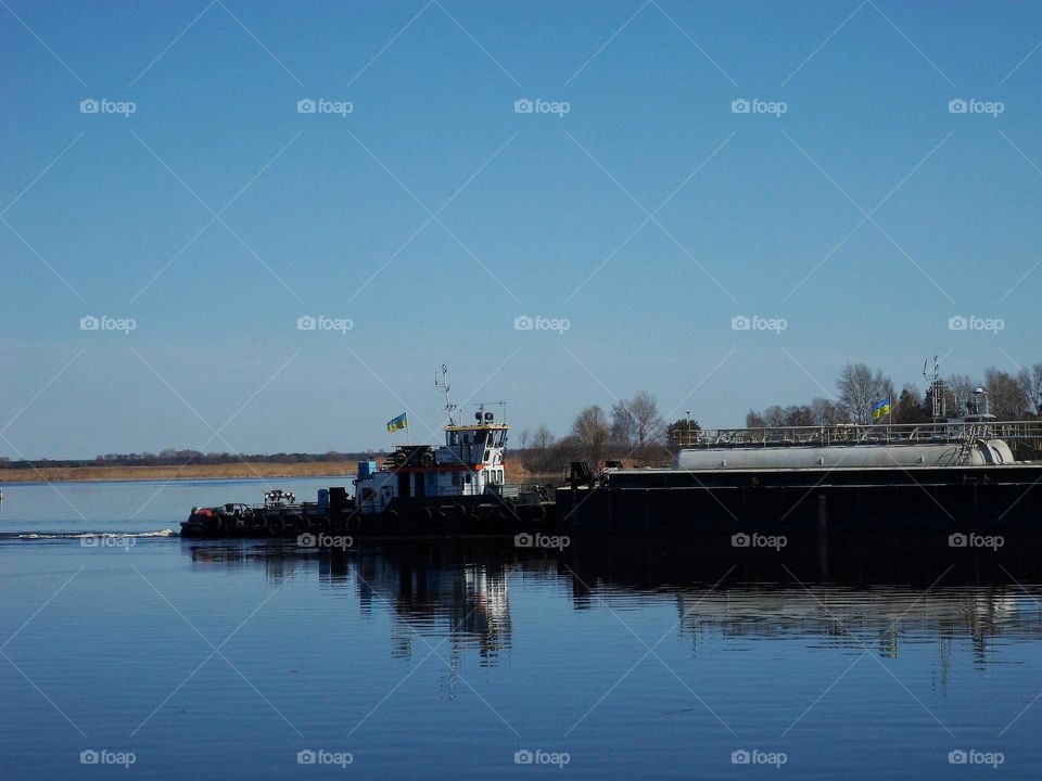 barge with a tugboat on the Dnieper River