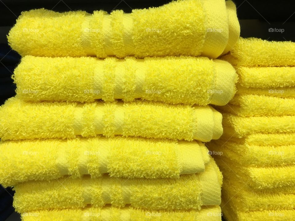 Picture of yellow towels. In high definition this picture was taken for those who need it you can use it as whatever you may.  I was bored I thought someone may put some good use to this picture of these towels. 