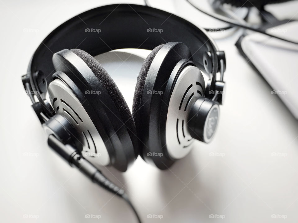 Black and white professional headphones. Selective focus. Music and relaxation concept 