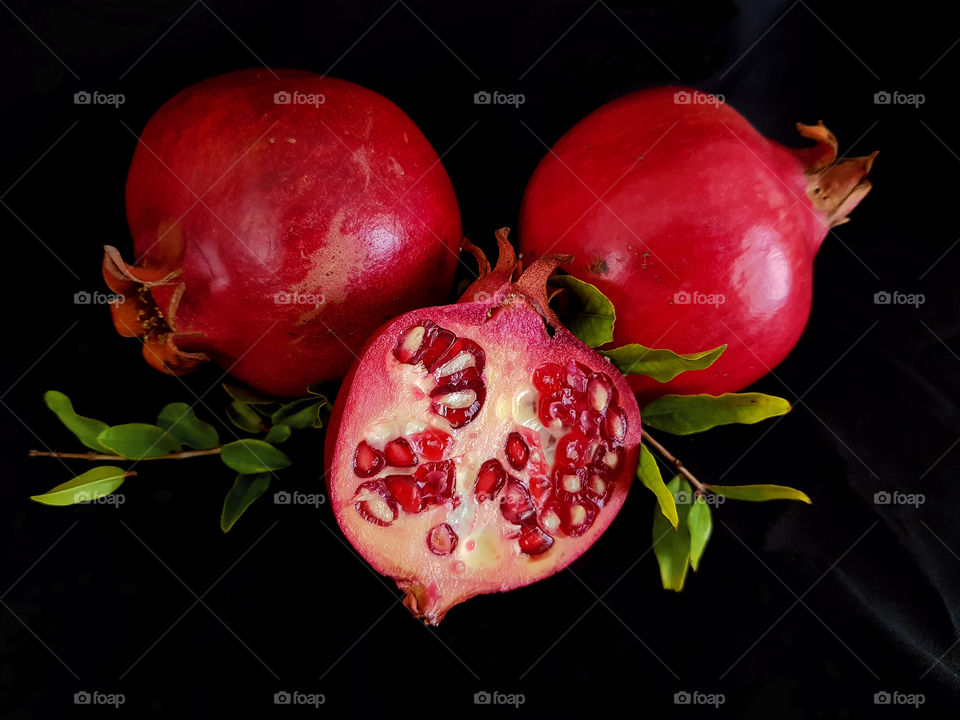 Three red pomegranates. jiucy