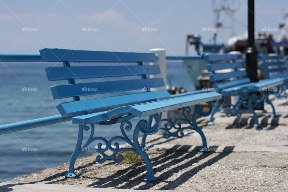 blue benches. blue benches at seaside