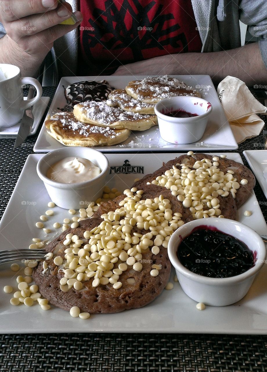 Delicious pancakes with chocolate and toppings