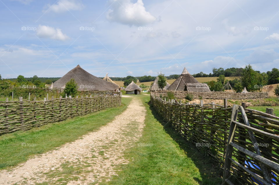 Ancient Iron Age British Village or Farm. Up until the Romans left Britain, most people still lived in mud huts, farming crops and keeping herds of cows, pigs and sheep.