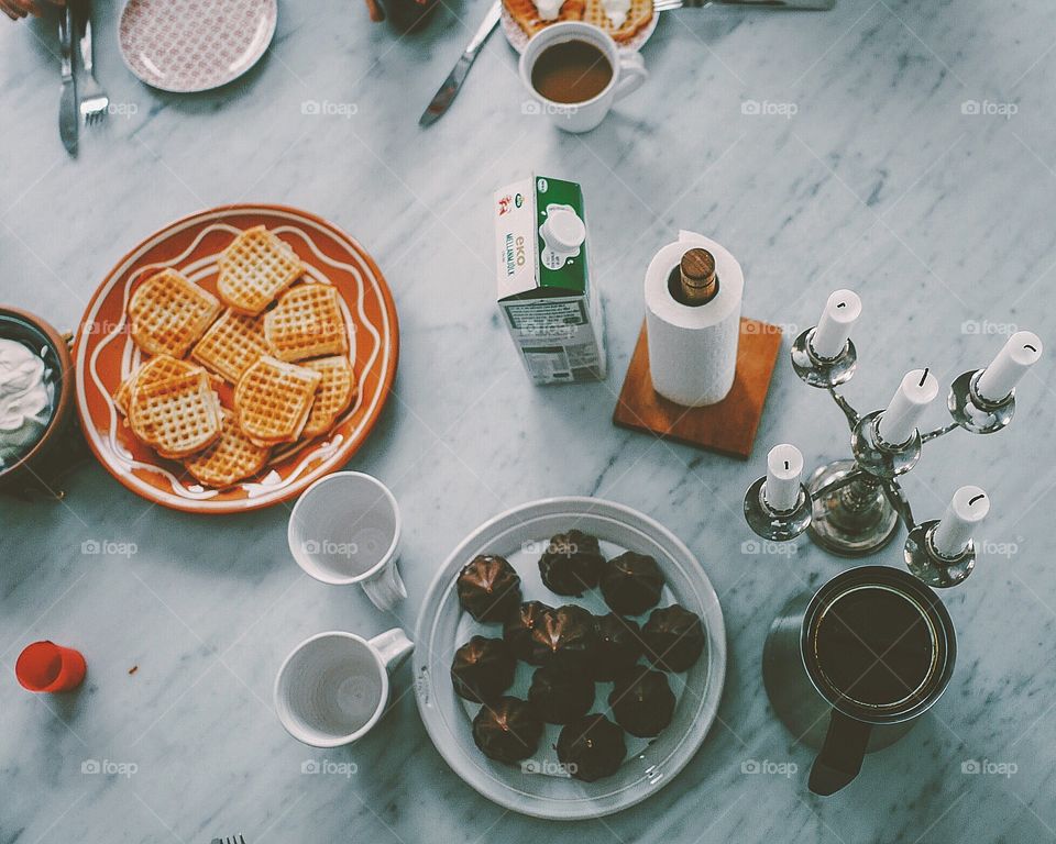 Topshot of a table with waffles and chocolate dessert