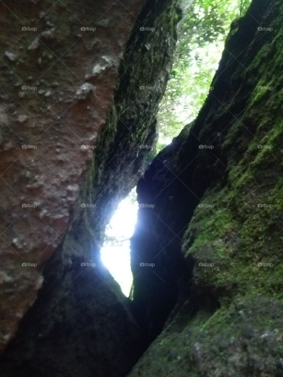 The sun comes between the rock