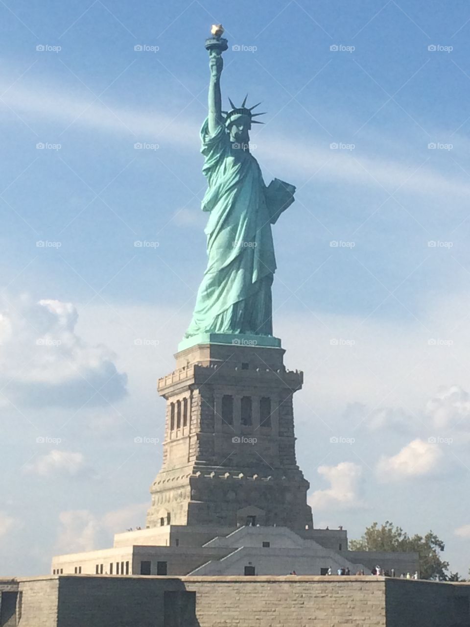 Statue of Liberty New York Harbor Liberty Island blue sky