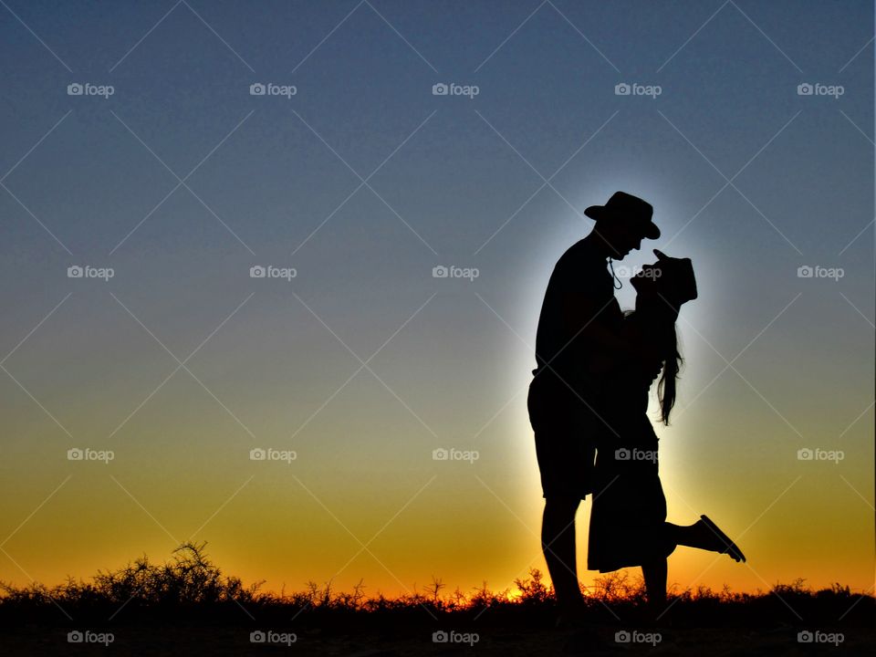 Oh my dear sweet love, i just love you! Couple looking into each other eyes, while the sun sets in Africa. Photo edited to match the real life look.