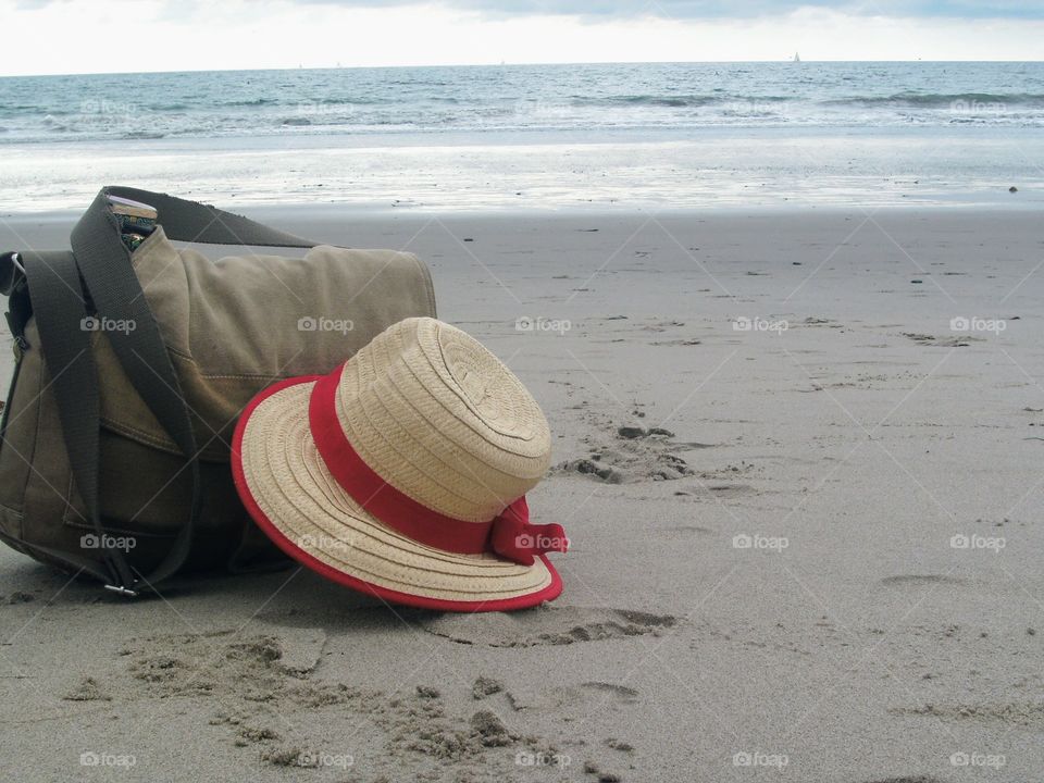Hat and bag on beach