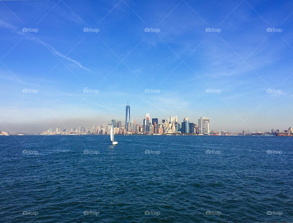 Stunning image of the Manhattan skyline from the boat to view the statue of liberty! 