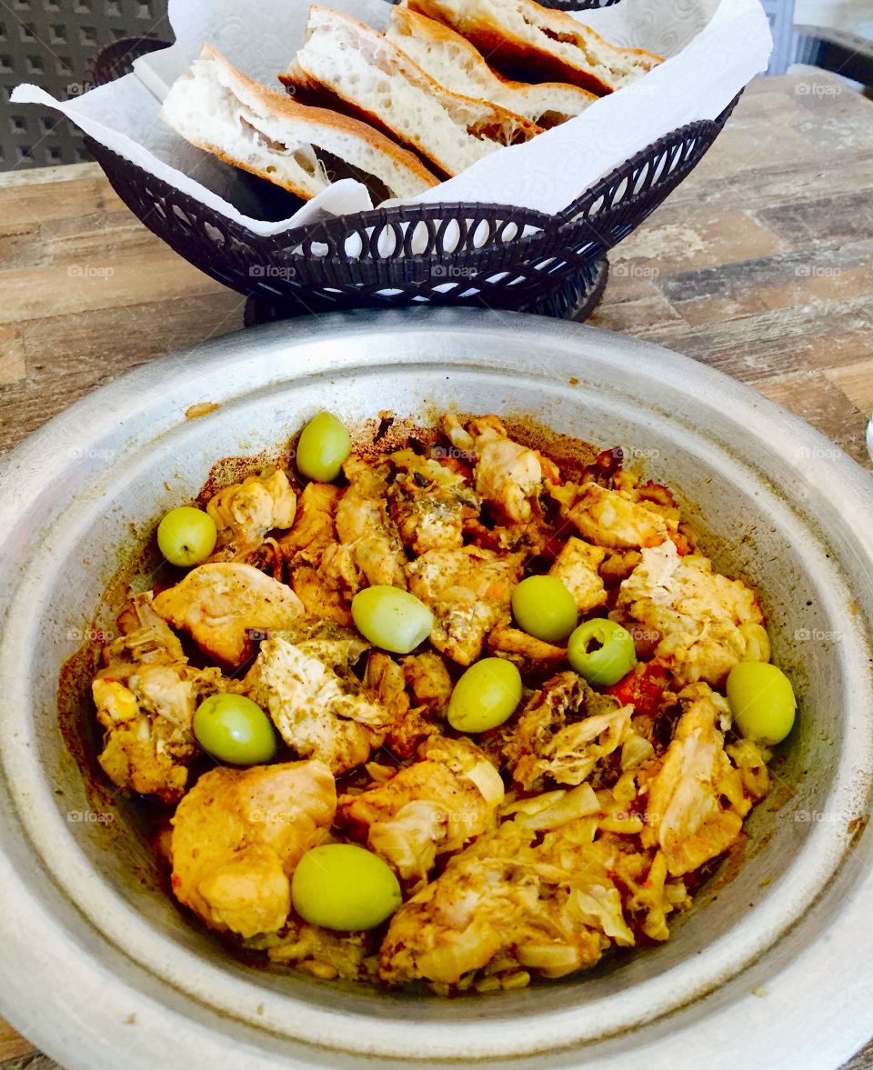 A chopped chicken dish with onions and olives