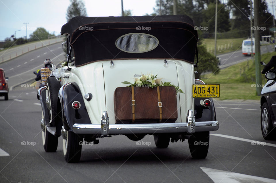 Antique car decorated with flowers for ceremonies
