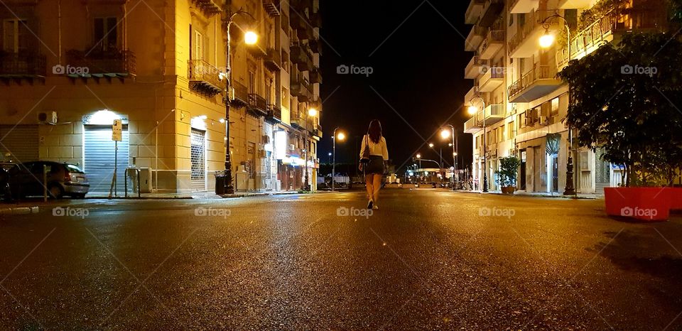 woman walking ,evening cityscape