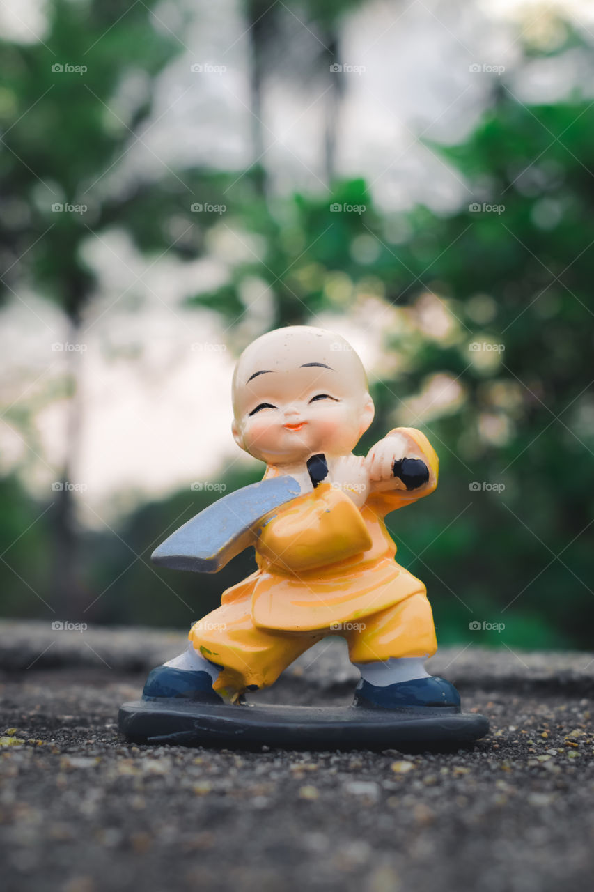 Cute superman superhero batman superman fantasy toy doll. Robotic alien fictional character adventure background. Part of series. Close up portrait. Outdoor childhood fun play leisure game for toddler