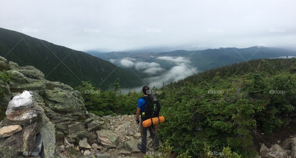 My friend overlooks the valley below Mount Madison as we hike the Appalachian Trail through the white mountains of Mew Hampshire