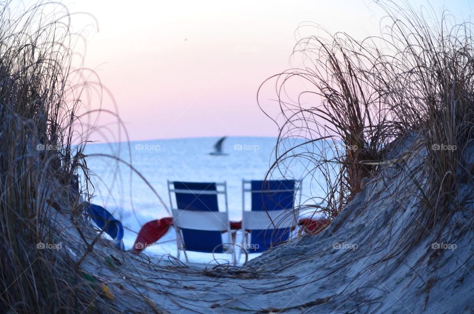 Two chairs on beach