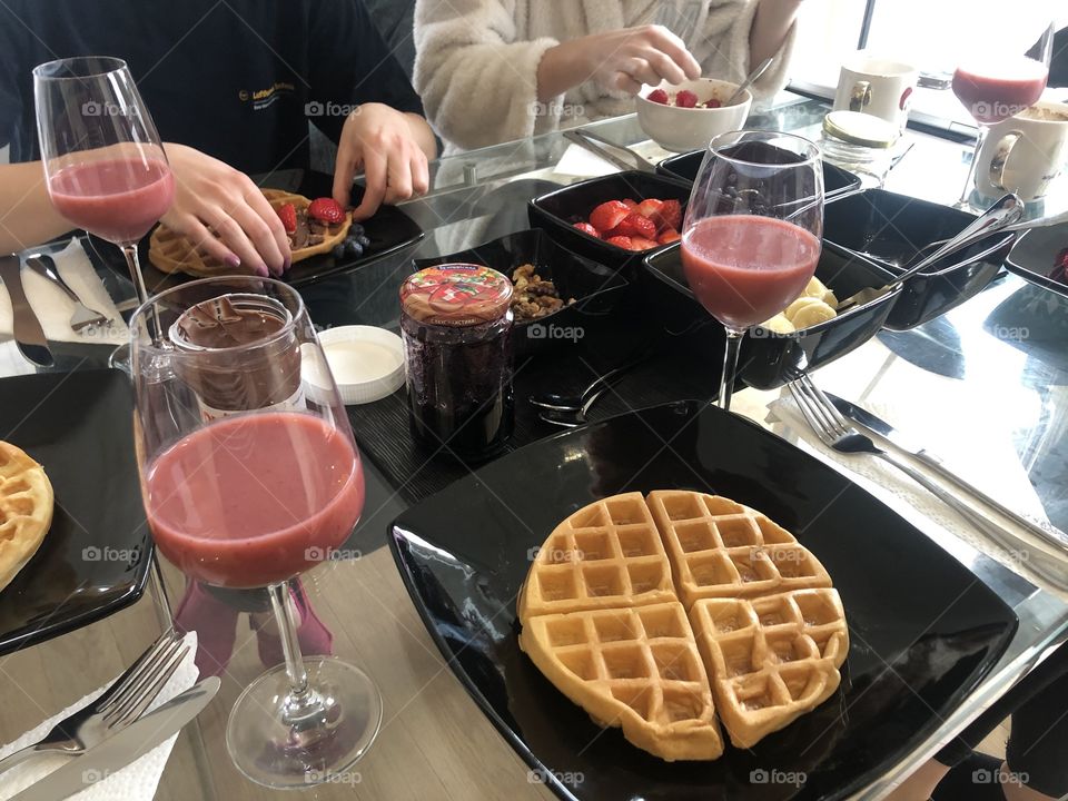 Delicios and healthy breakfast - waffles, strawberries, bananas