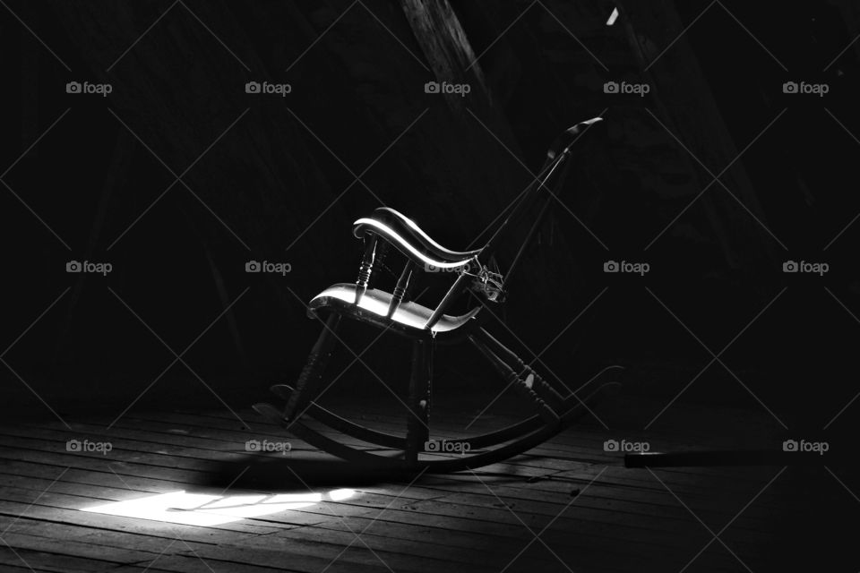rocking chair in the dark attic