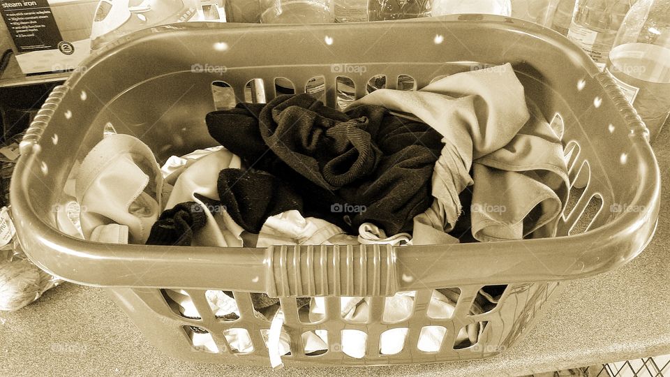basket of clothes in sepia tone