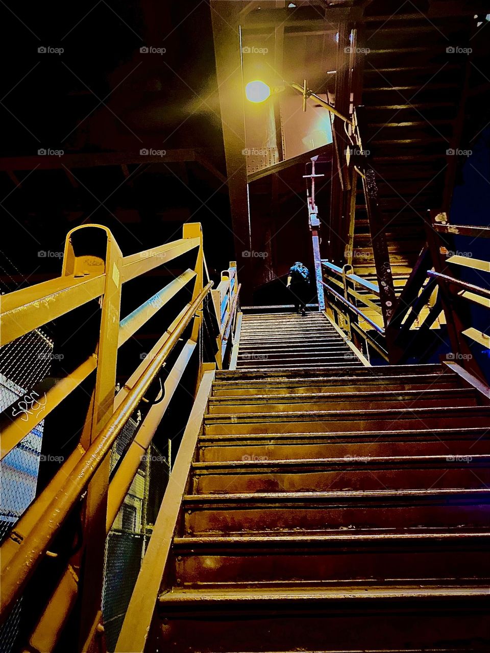 Ascending up the steps leading to the top of the “Pulaski Bridge” from the “Greenpoint”, Bklyn side one evening in October 2022. Hypnotic Productions
