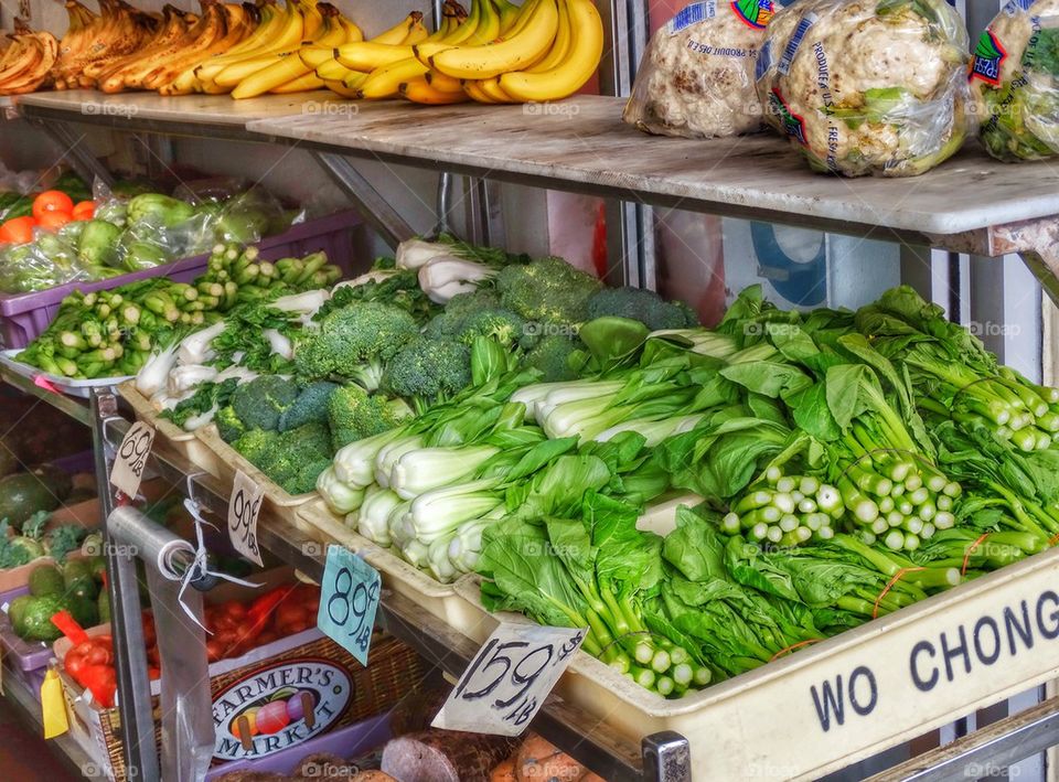 Fresh Vegetables In A Chinese Street Market. Green Vegetables On Display At A Chinese Street Market
