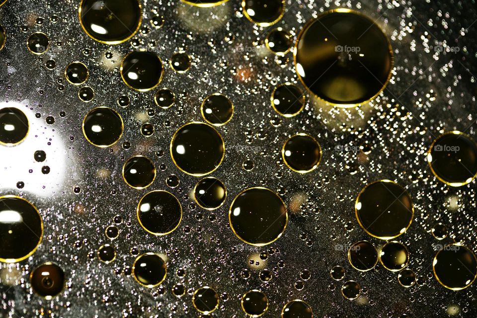 Golden oil Bubbles Close Up background amazing colours droplets of life in black texture macro look summer mood positive vibes wonderful day hustling daydreaming