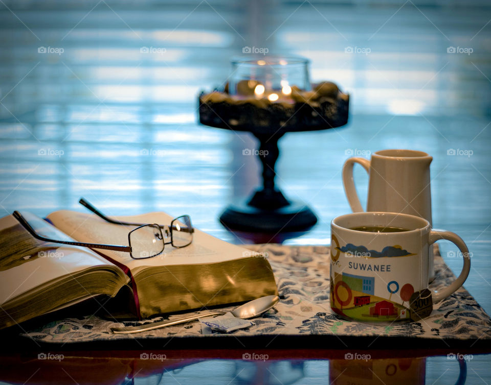 Reading and enjoying a cup of tea
