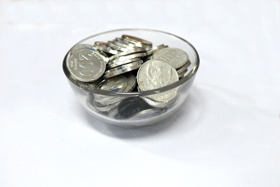 photo of change or coins with a white background