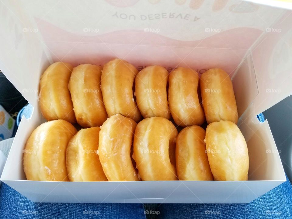 Fresh Glazed Donuts All In A Row