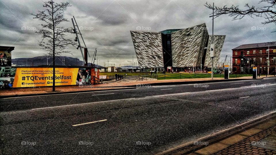 The huge Titanic museum in Belfast from far away in a cloudy day