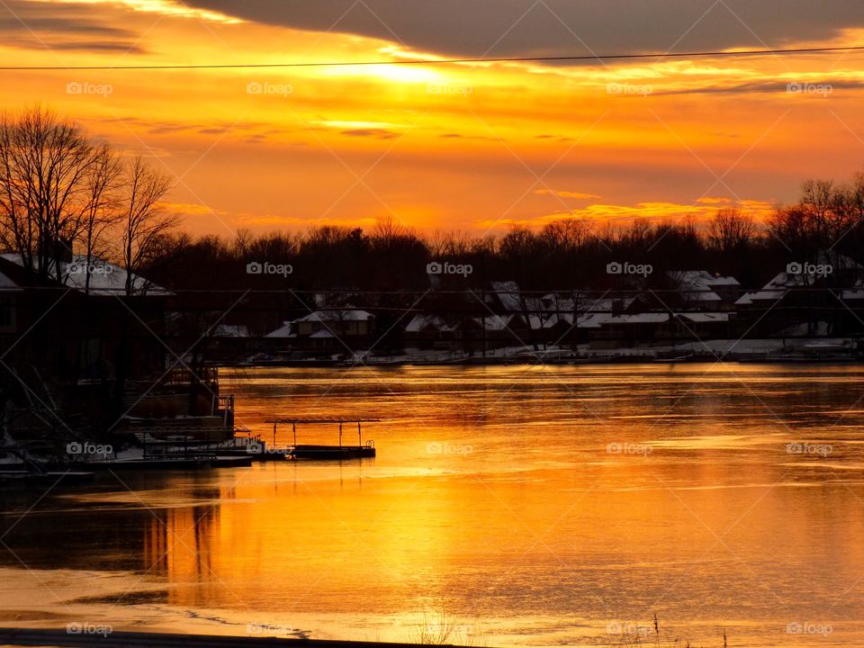 Sunset on the frozen lake. 