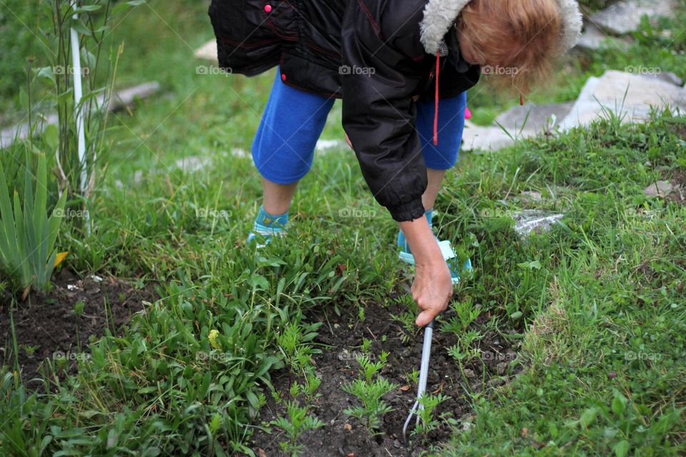 Woman planting in the garden