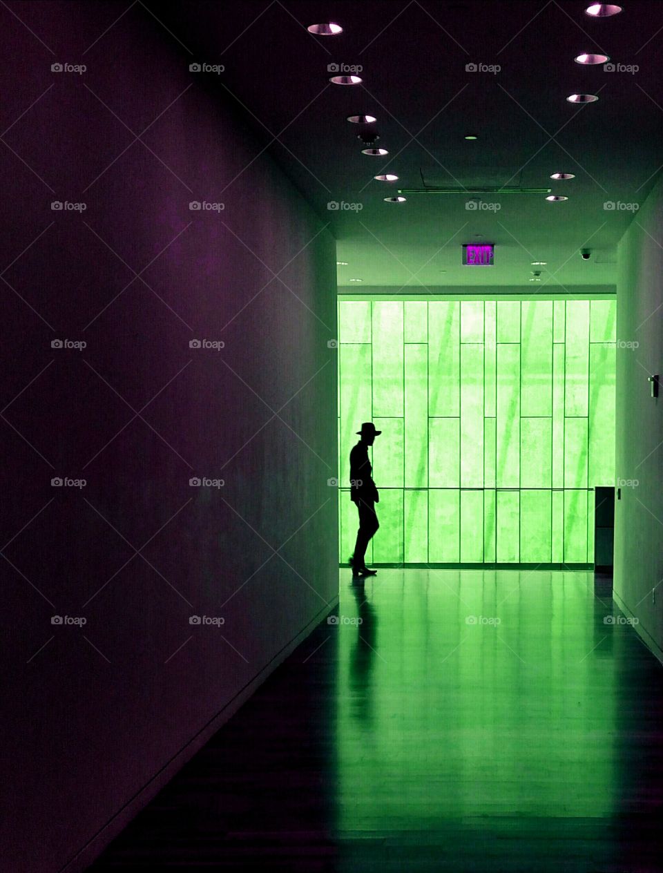 Silhouette Of man standing on corridor
