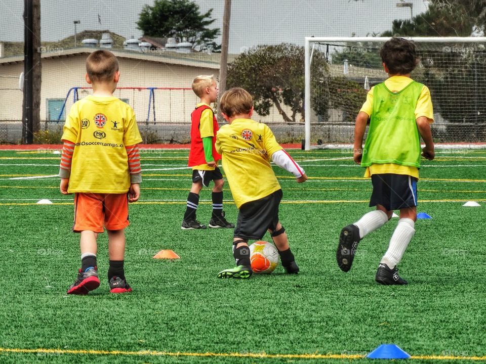 Youth Soccer. Children Playing On A Soccer Pitch
