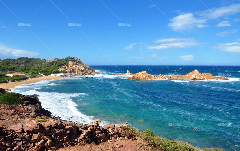 cliffs on the beach at menorca Balearic island in Spain