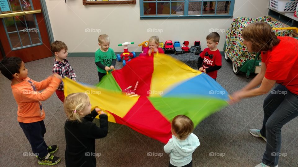 Preschool and Pre K aged young children play games at school and daycare.