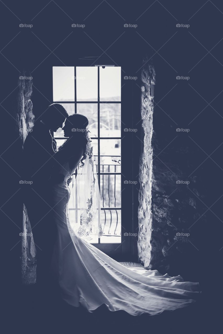 Silhouette of couple in house