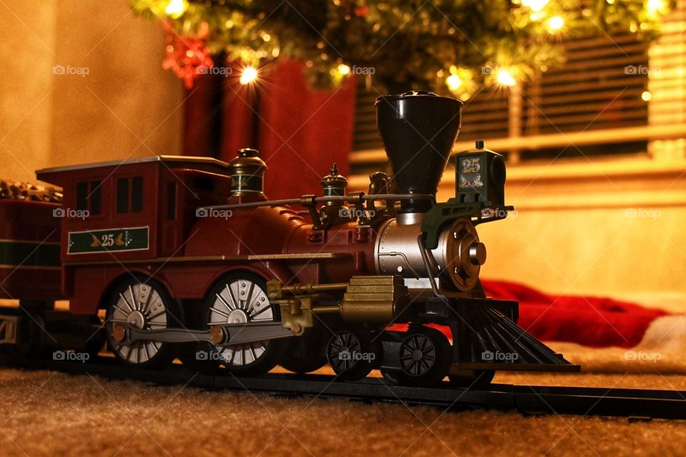 A train under a Christmas tree