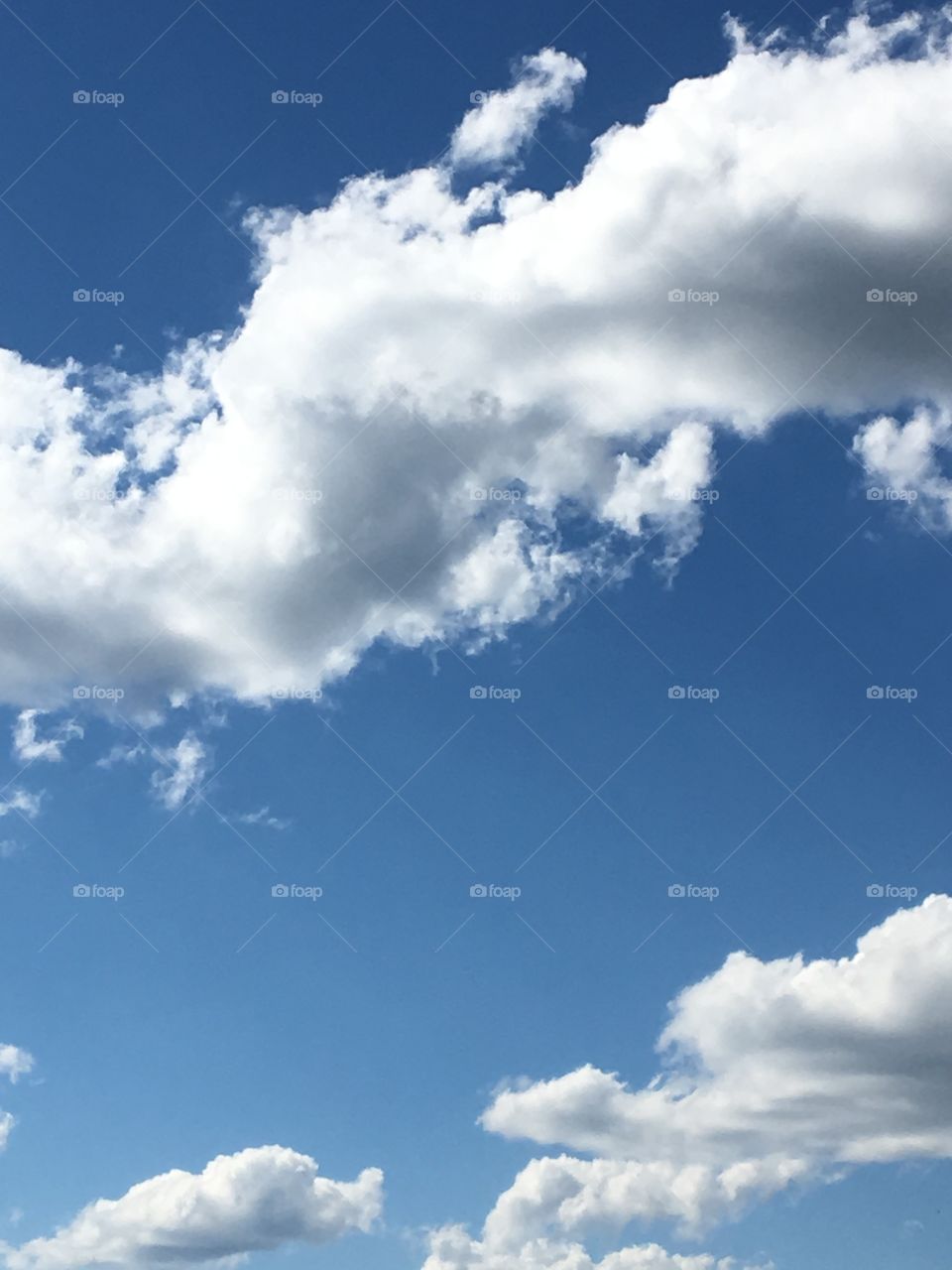 Blue skies & white billowing clouds
