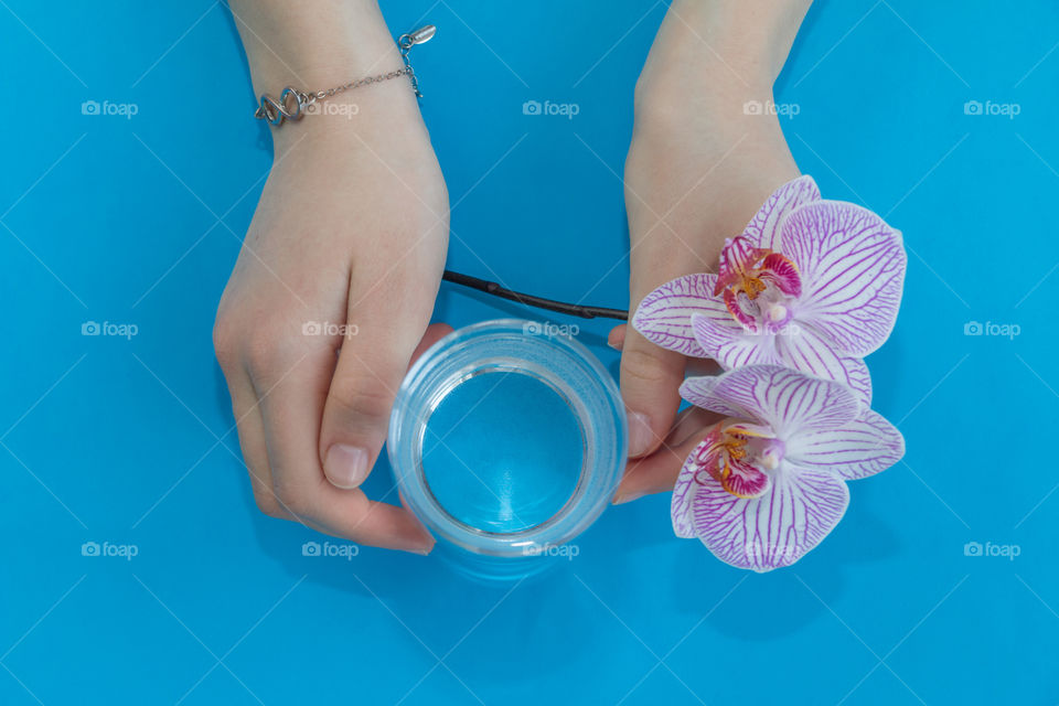 a glass of water in hands