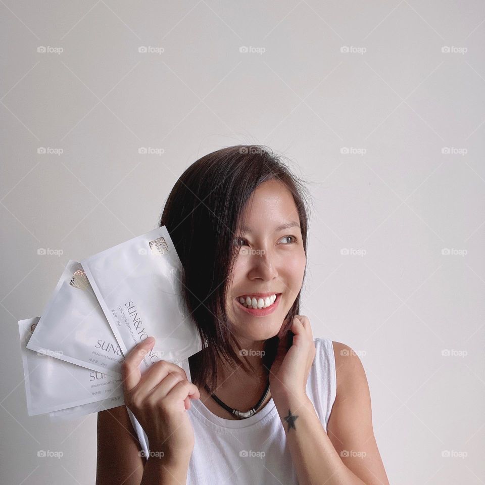 Asian woman with skincare face mask