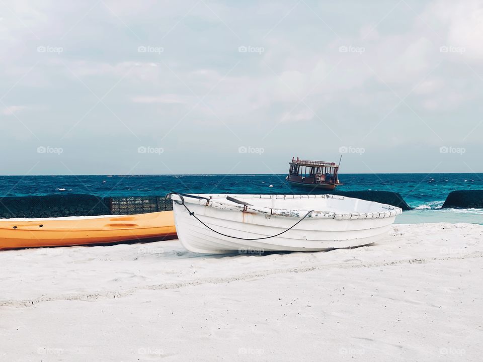 White wooden boat on the beach 