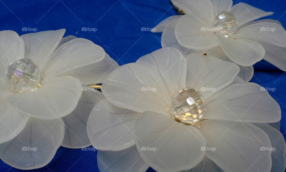flower crystal jewelry on blue polyester