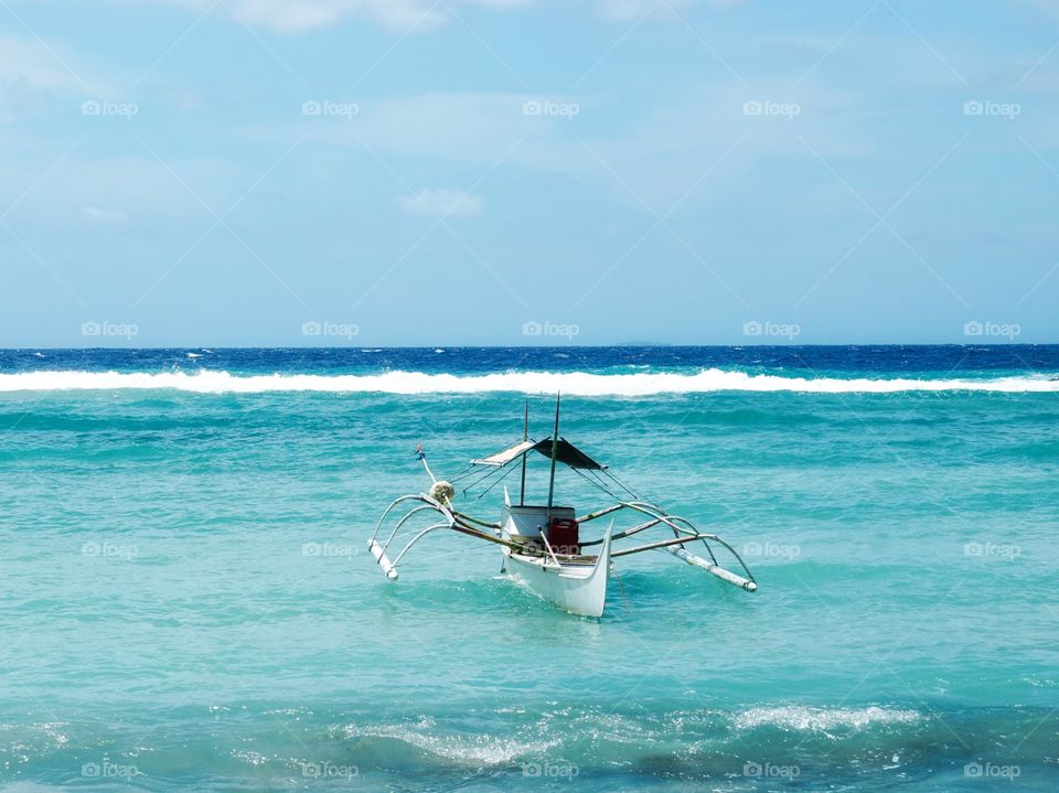 A boat in the middle of the sea