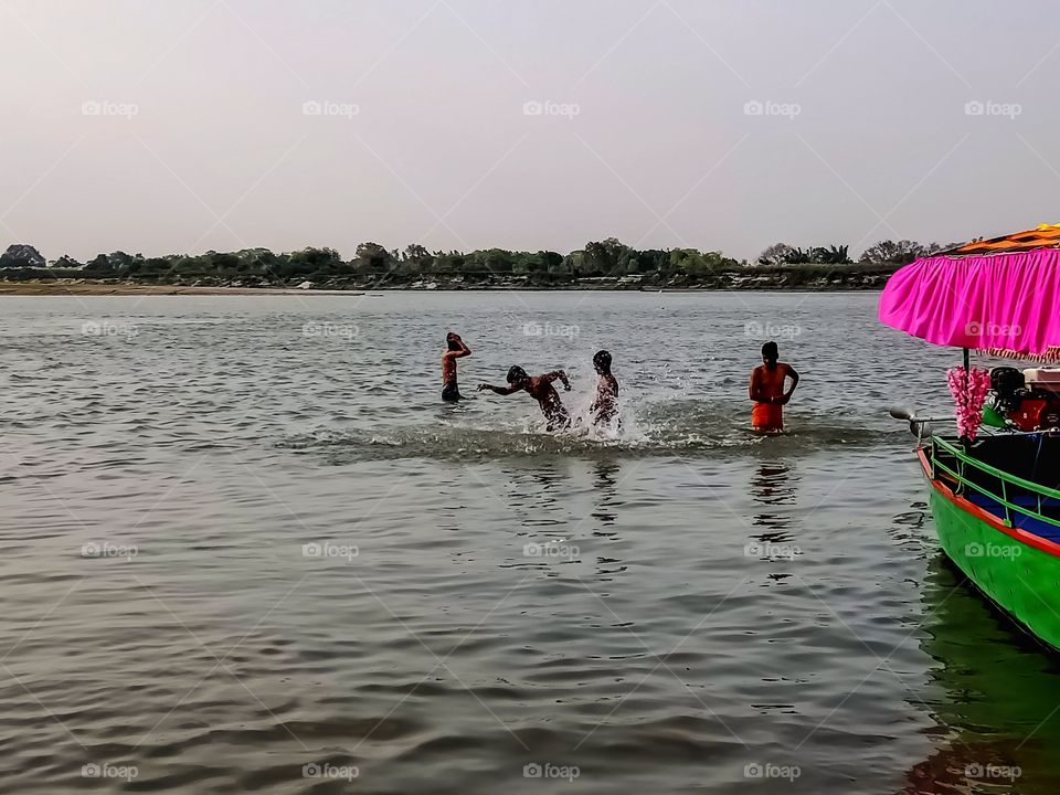 Some boys bathing in a river awesome image india