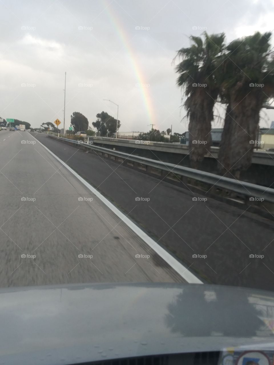 rainbow over road